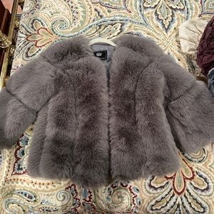 Light gray faux fur jacket.